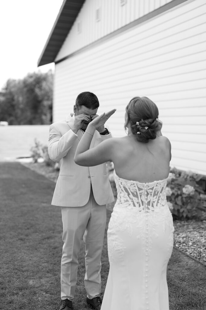 emotional bride and dad first look