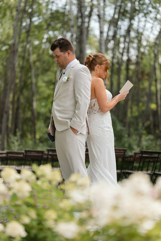 emotional bride and groom reading letters to each other back to back