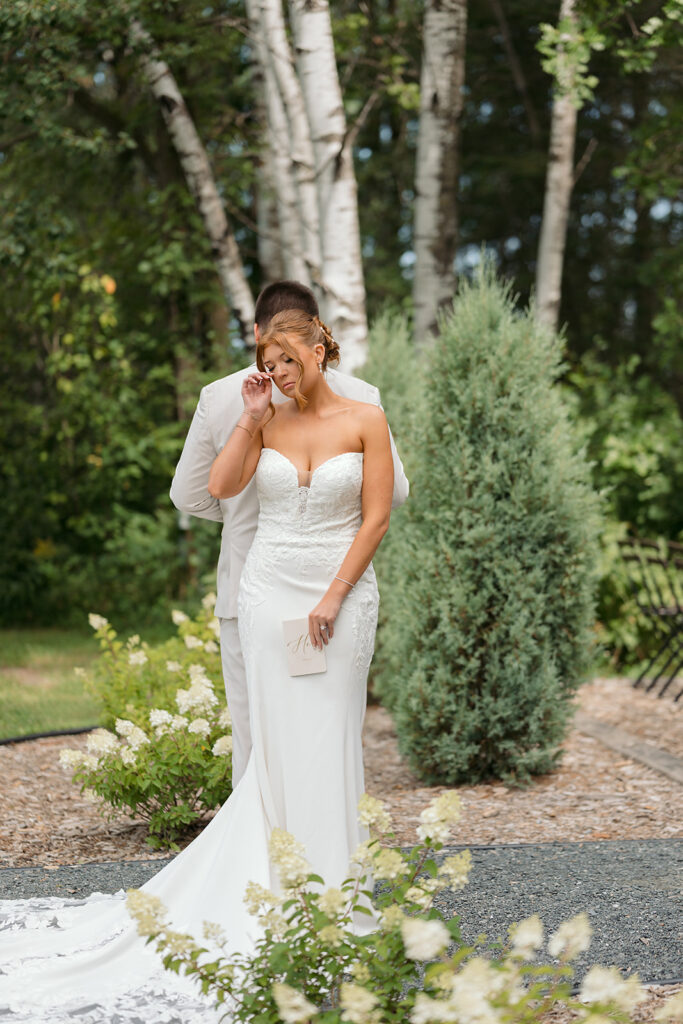 emotional bride and groom reading letters to each other back to back