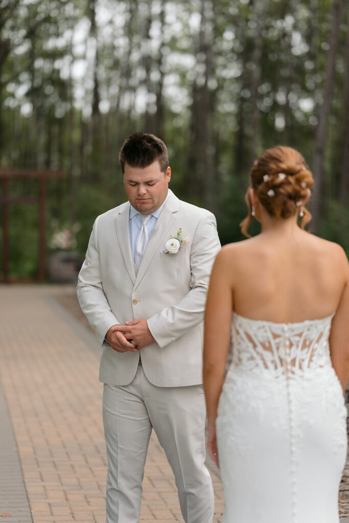 emotional bride and groom first look
