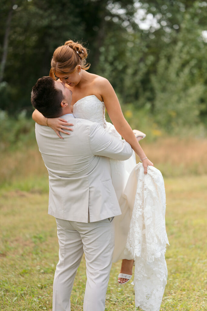 bride and groom in a lush field during golden hour at the bluebelle event venue