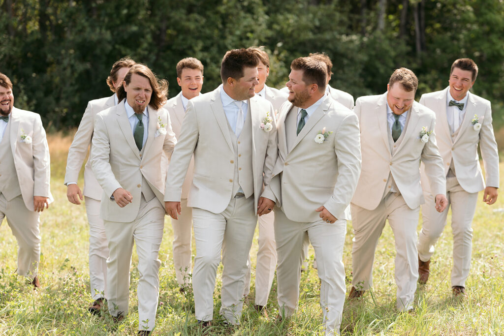 groom and groomsmen in tan suits