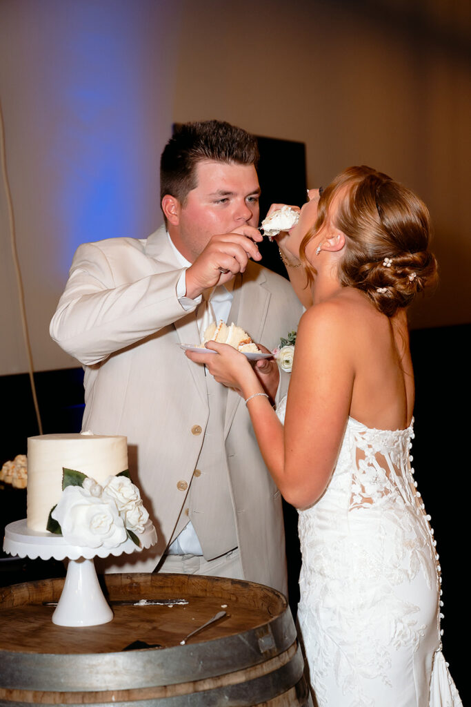 bride and groom cutting cake at the bluebelle event venue