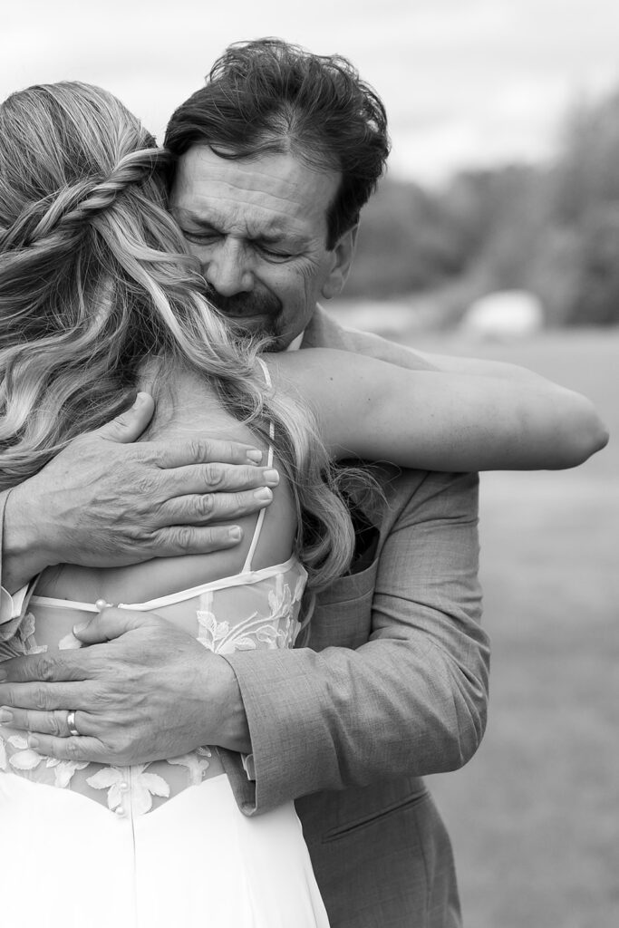 emotional bride and dad first look