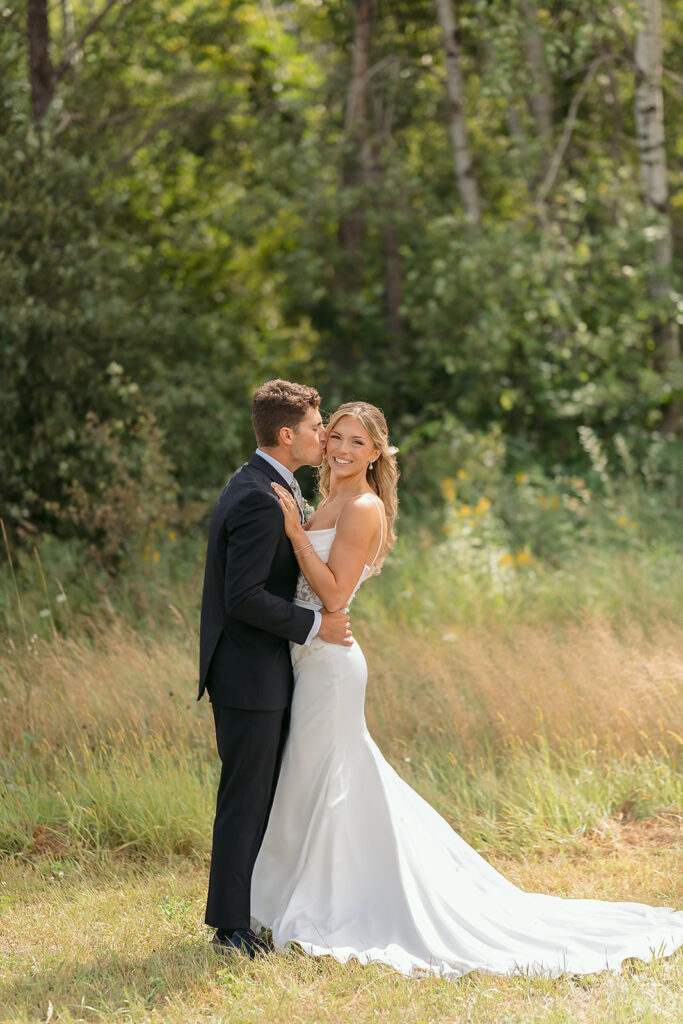 golden hour bride and groom moments in a lush field at bluebelle event venue