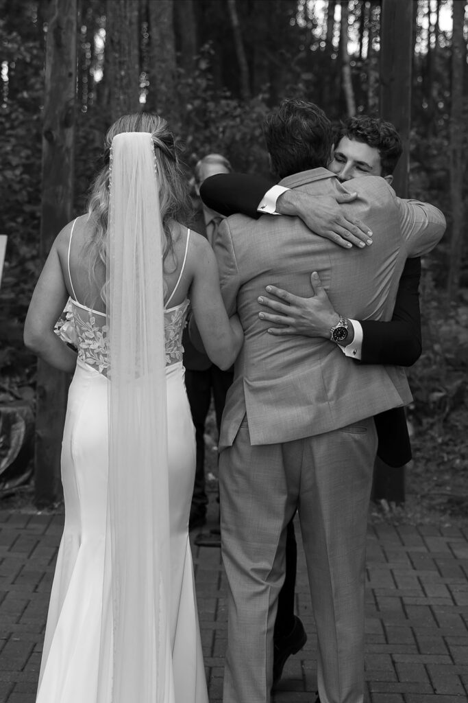 dad walking bride down the aisle during the outdoor wedding ceremony at the bluebelle event venue