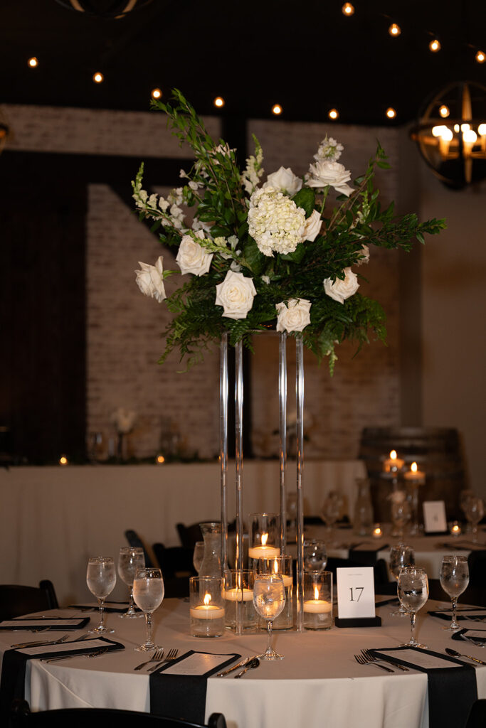 elegant black and white wedding table settings for an indoor reception at the bluebelle event venue