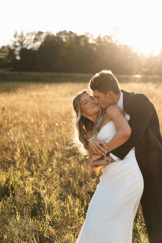 romantic rainy wedding photos at a lush field