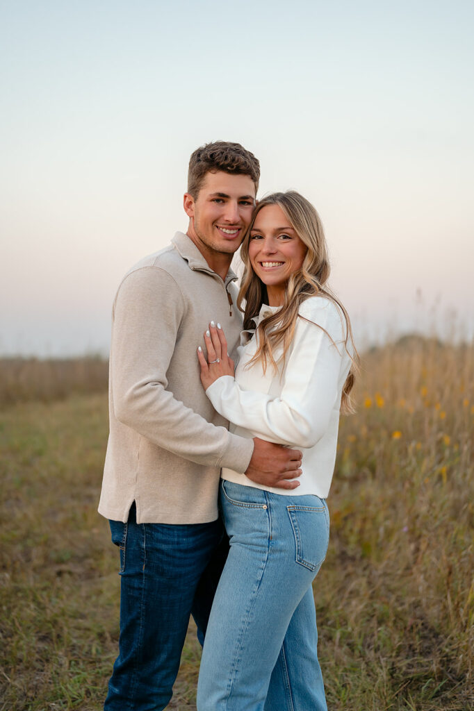couple during blue hour in a lush golden field