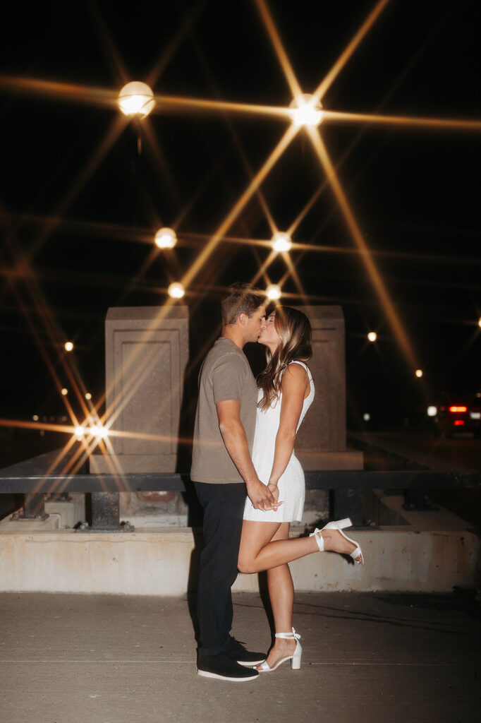 playful couple and direct flash downtown bemidji engagement photos