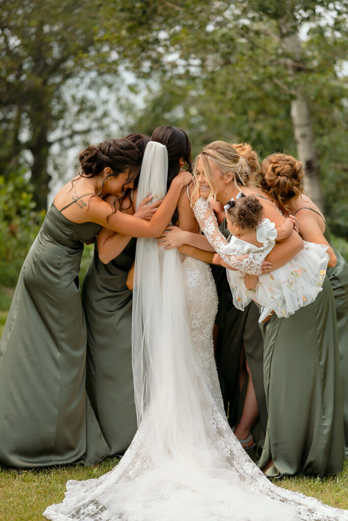 bride and bridesmaids first look