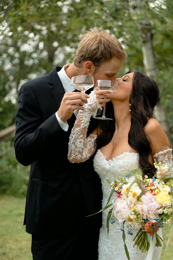 bride and groom cheering with champagne