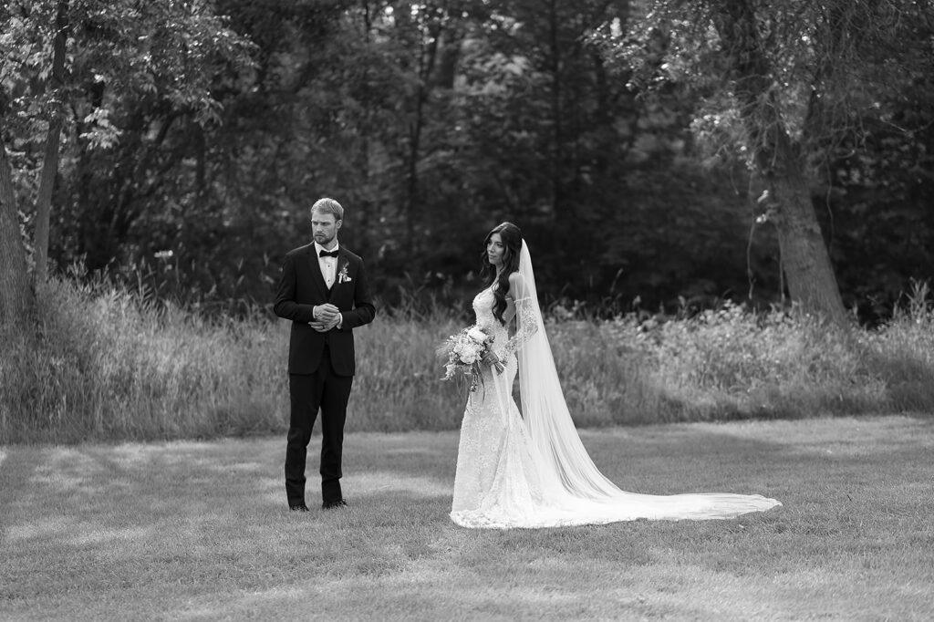 bride and groom surrounded by lush green landscapes during their lakeside wedding in bemidji mn