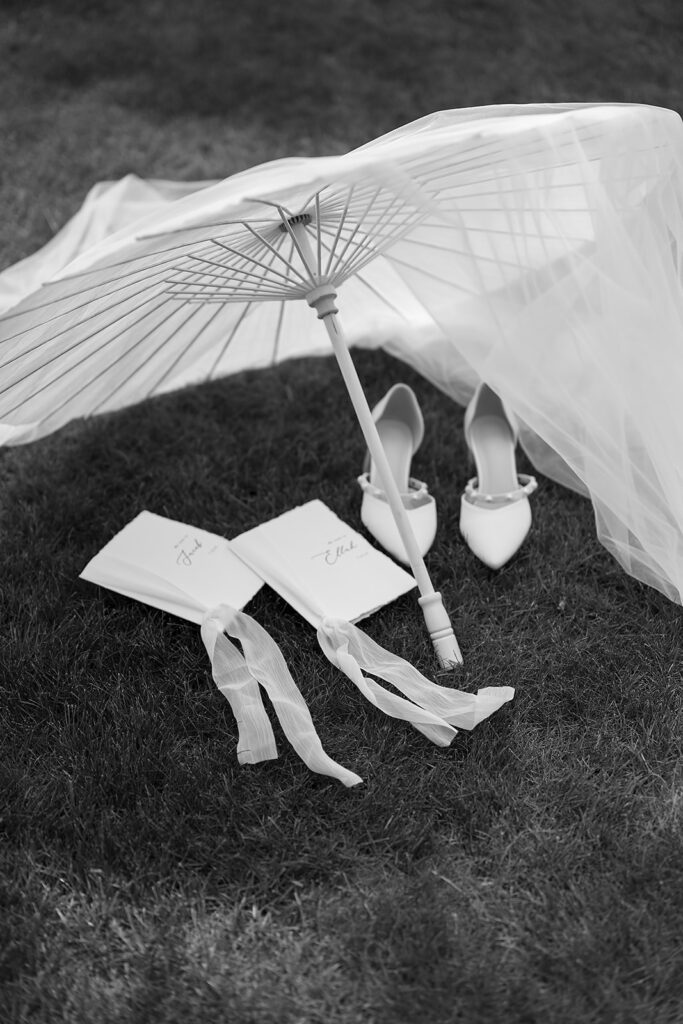 close up of bridal details laid on the grass