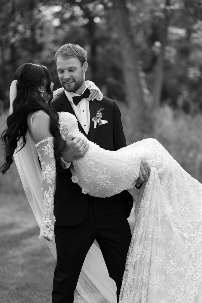 bride and groom surrounded by lush green landscapes during their lakeside wedding in bemidji mn