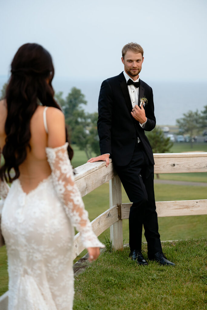 bride and groom surrounded by lush green landscapes during their lakeside wedding in bemidji mn