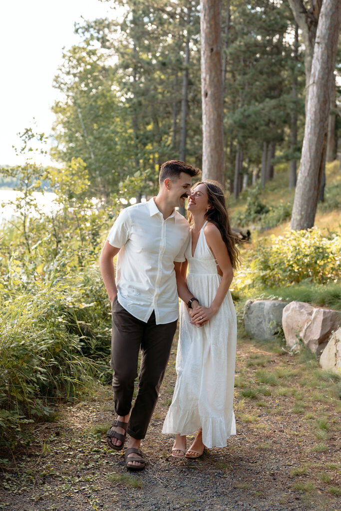 romantic Catalyst By Nature Link engagement photos in a lush forest next to lake