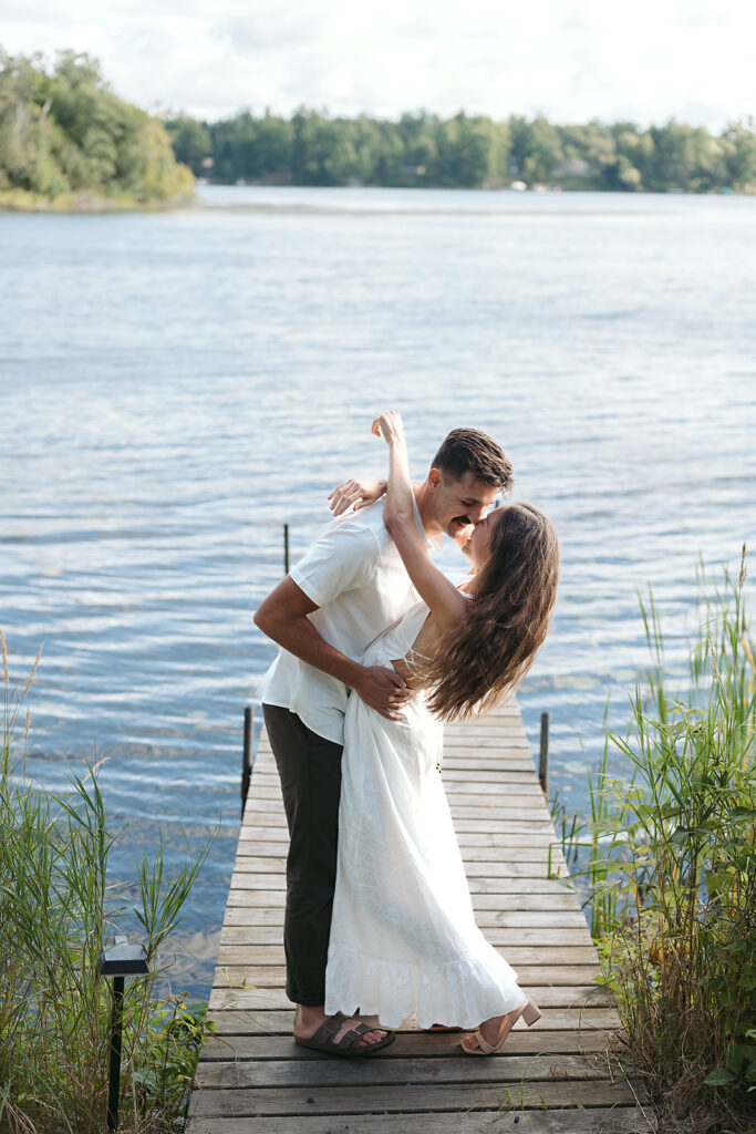 romantic Catalyst By Nature Link engagement photos on a lake dock