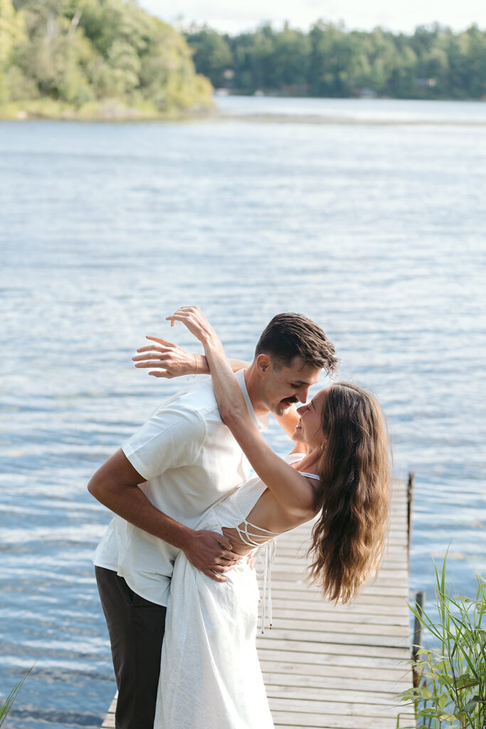 playful couple in the lake during their romantic Catalyst By Nature Link engagement session
