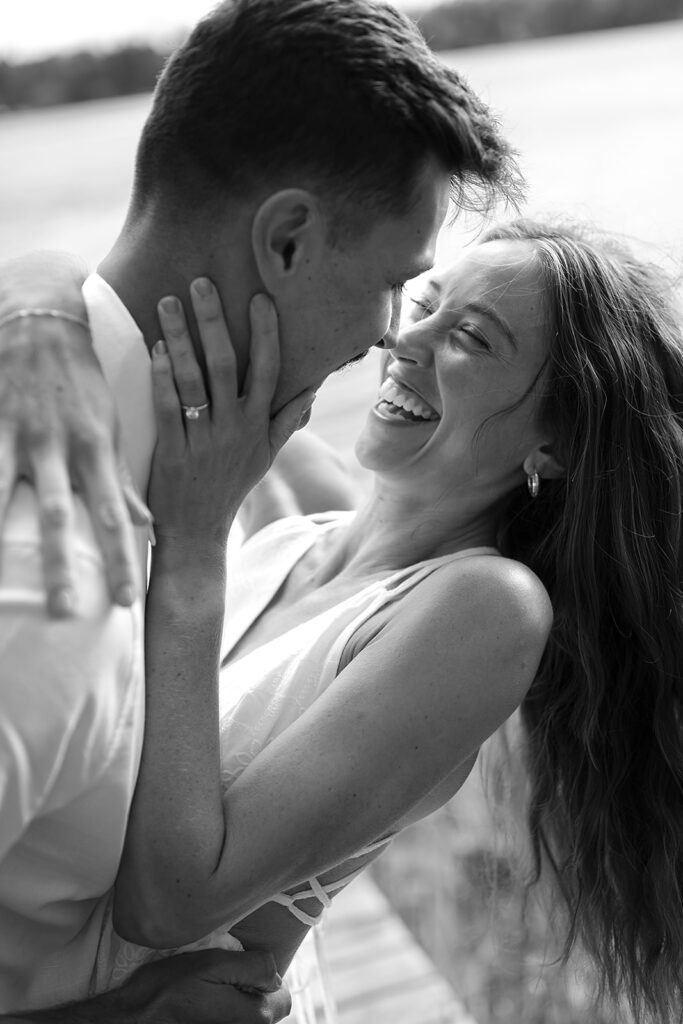 playful couple in the lake during their romantic Catalyst By Nature Link engagement session