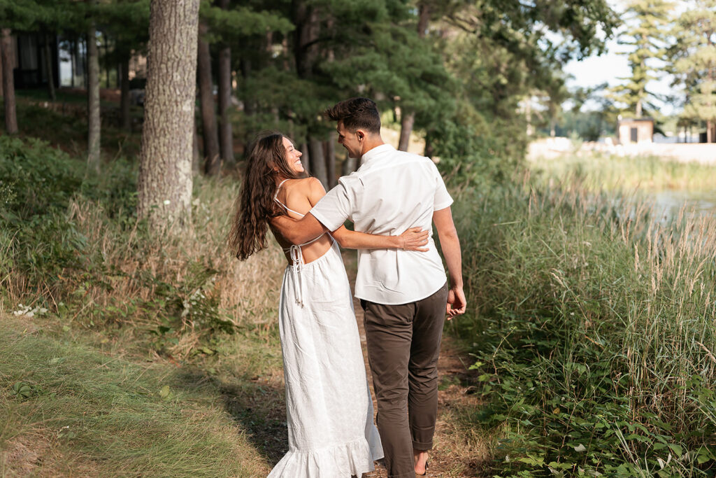 romantic Catalyst By Nature Link engagement photos in a lush forest next to lake