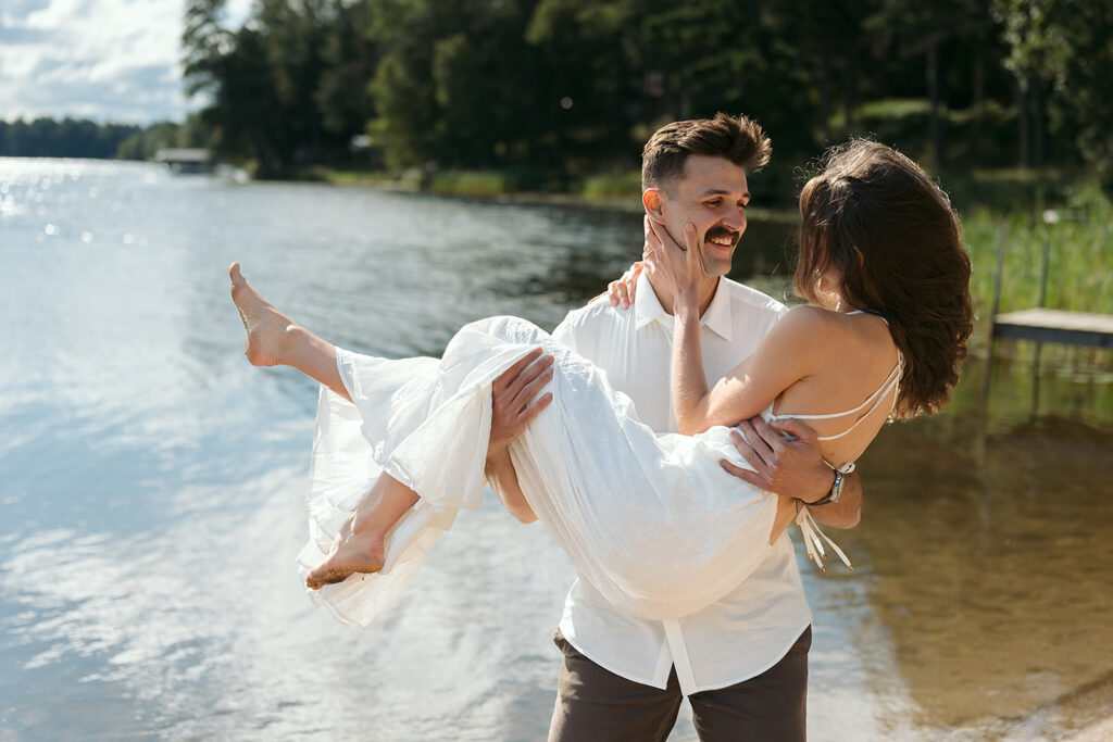 romantic Catalyst By Nature Link engagement photos in a lush forest next to lake