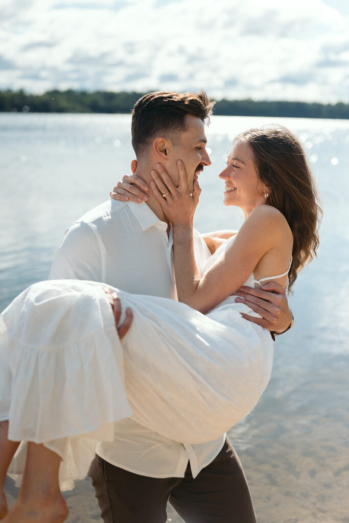 playful couple in the lake during their romantic Catalyst By Nature Link engagement session