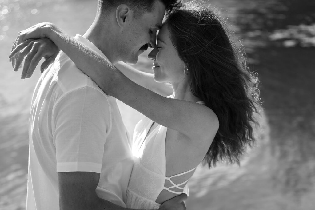 playful couple in the lake during their romantic Catalyst By Nature Link engagement session