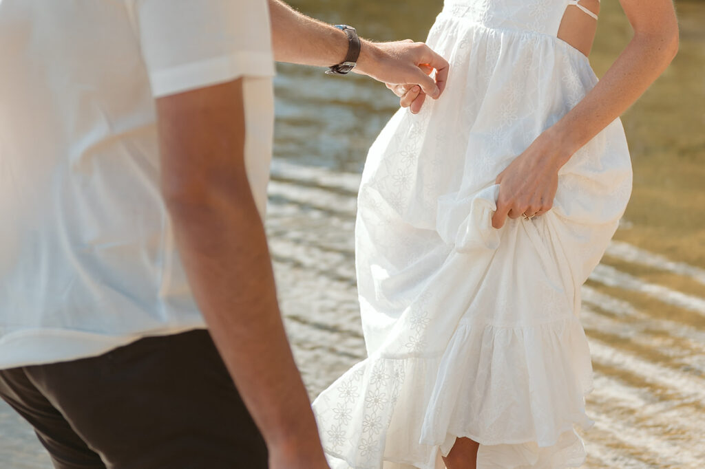 playful couple in the lake during their romantic Catalyst By Nature Link engagement session