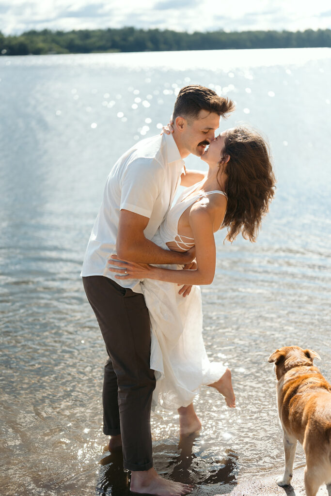 playful couple in the lake during their romantic Catalyst By Nature Link engagement session