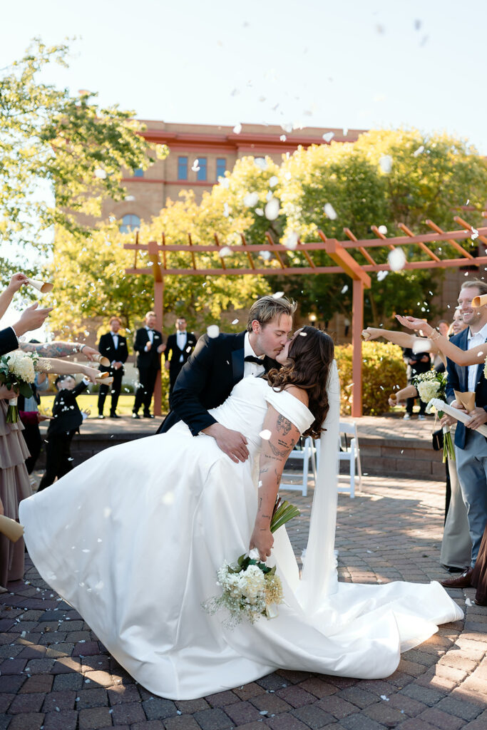 outdoor courthouse wedding ceremony exit kiss at Beltrami County Courthouse