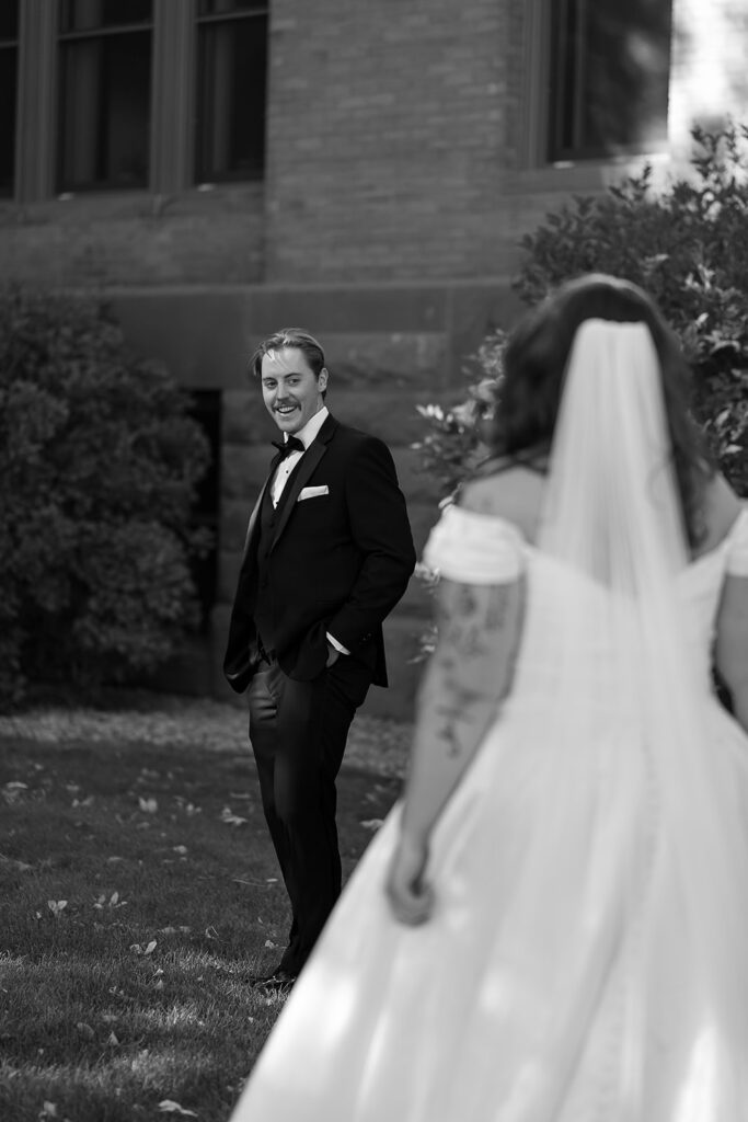 first look and private vow exchange in front of Beltrami County Courthouse during their Minnesota courthouse wedding