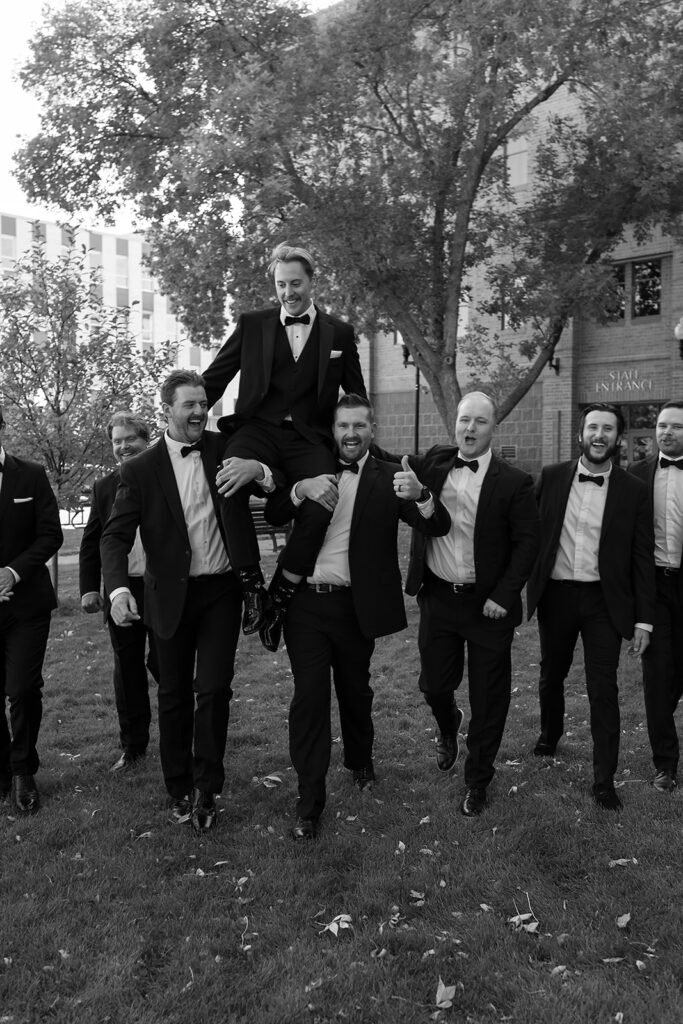 groom and groomsmen in front of Beltrami county courthouse