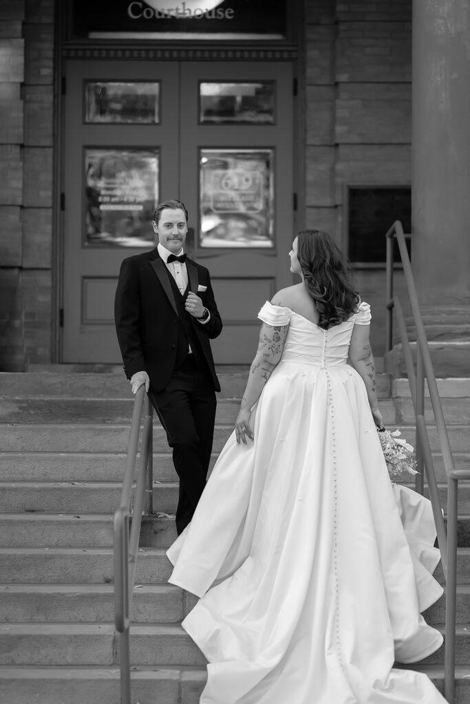 bride and groom in front of Beltrami county courthouse