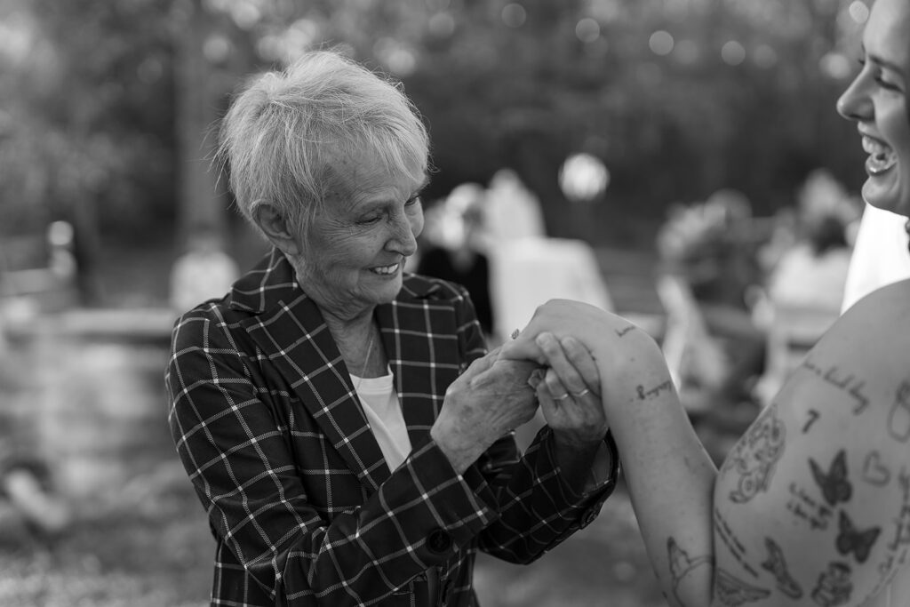 candid guest moments garden party inspired backyard wedding reception