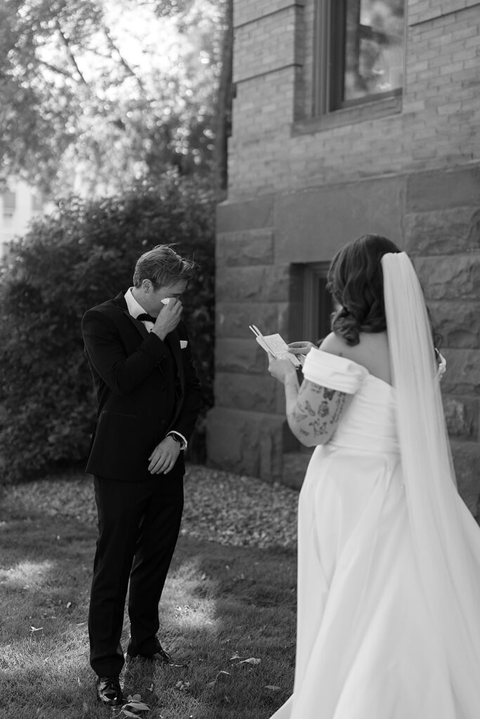 first look and private vow exchange in front of Beltrami County Courthouse during their Minnesota courthouse wedding
