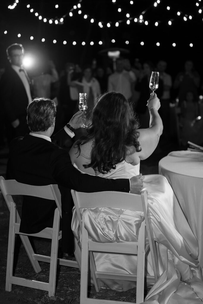bride and groom listening to toasts