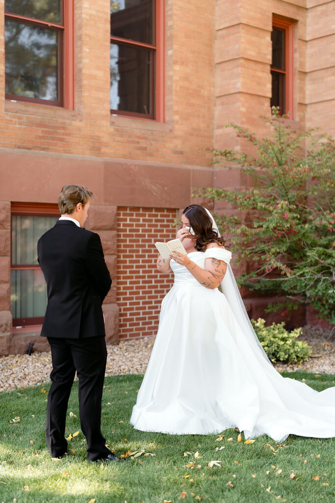 first look and private vow exchange in front of Beltrami County Courthouse during their Minnesota courthouse wedding