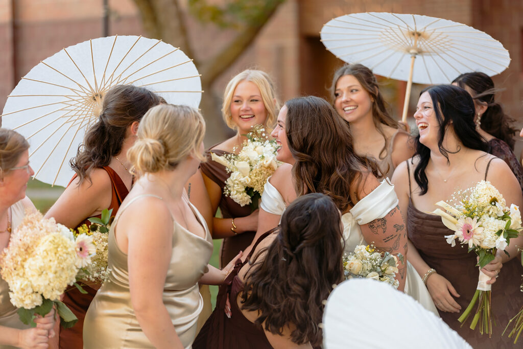 bride and bridesmaids with parasols
