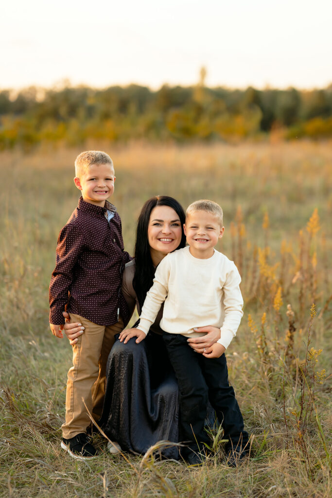 mom posing with her two little boys