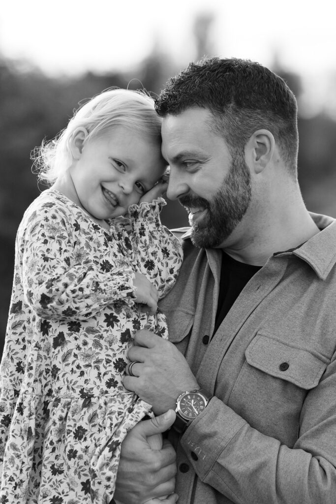 dad hugging his little daughter