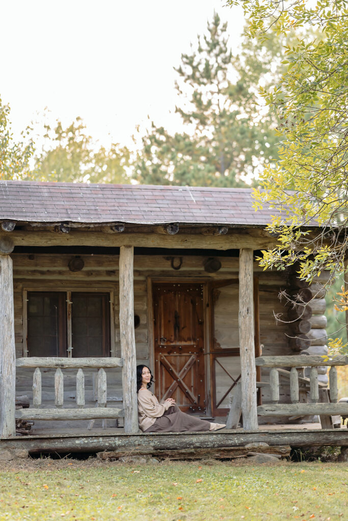 fall senior photos at a rustic cabin in minnesota