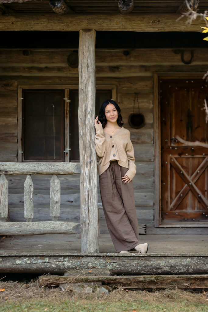 fall senior photos at a rustic cabin in minnesota