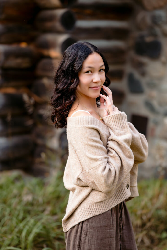 fall senior photos at a rustic cabin in minnesota