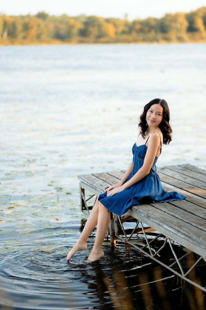 fall senior photos on a lake dock in western minnesota