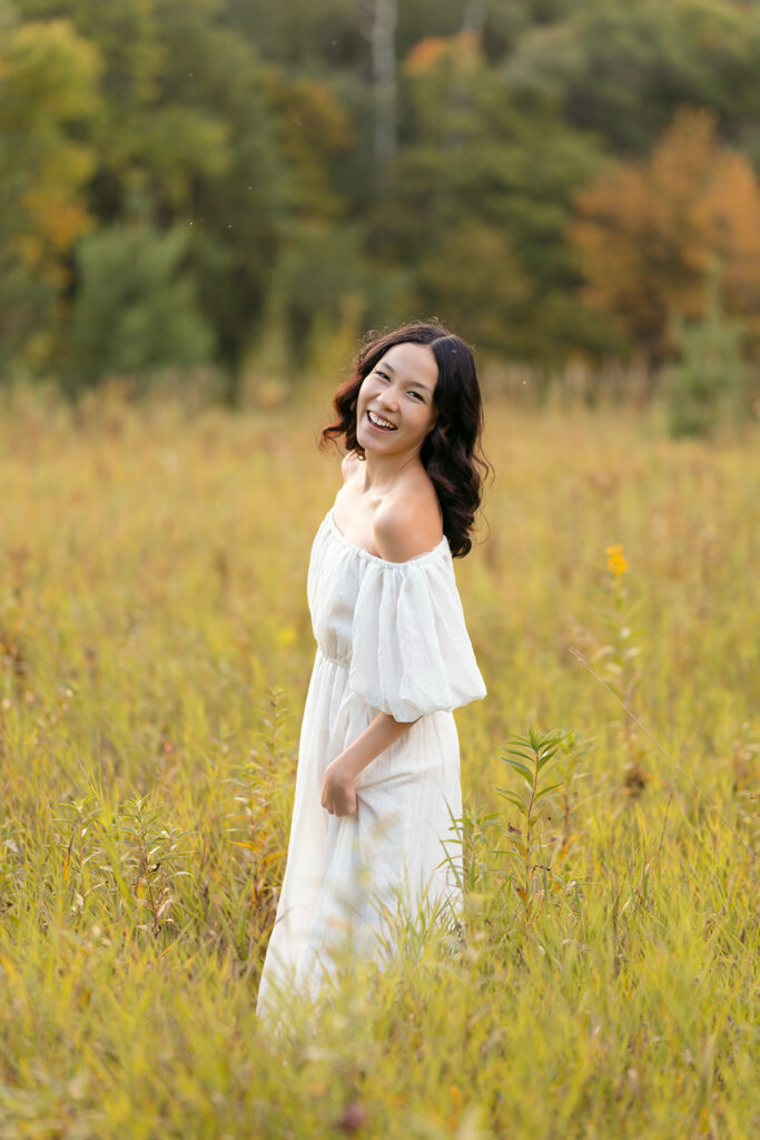 fall senior photos in a lush field in western minnesota
