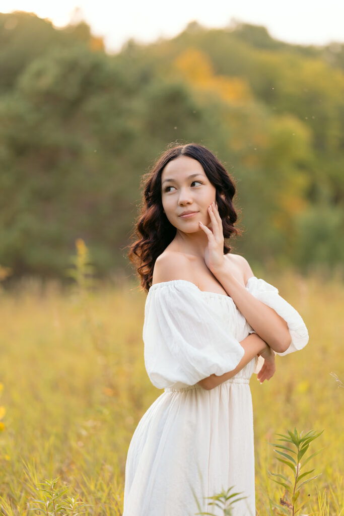 fall senior photos in a lush field in western minnesota