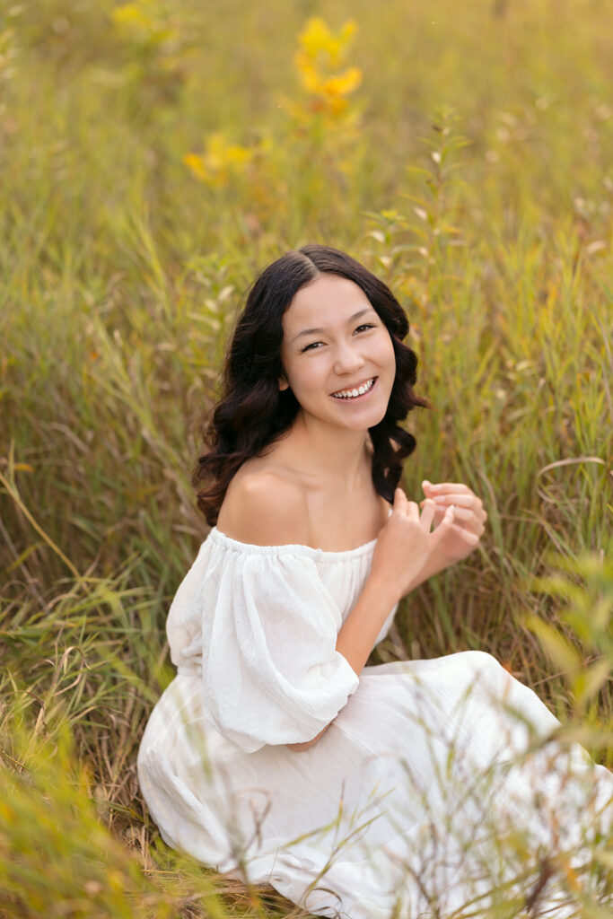 fall senior photos in a lush field in western minnesota