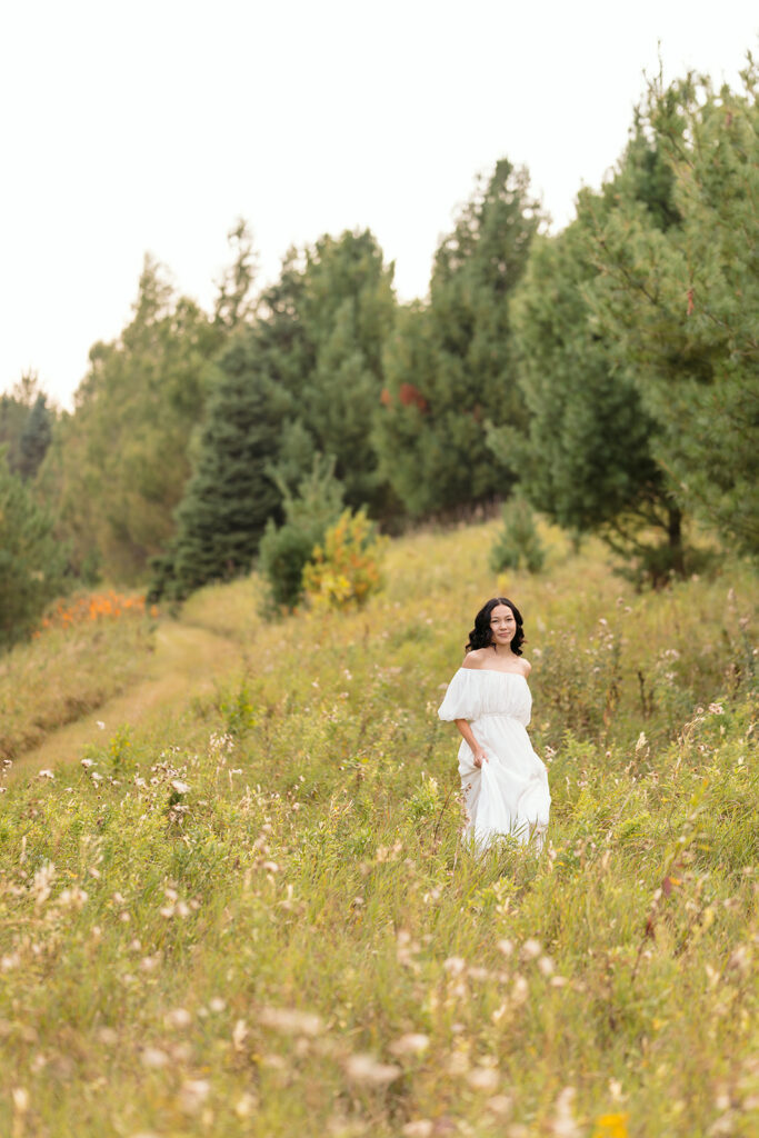 fall senior photos in a lush field in western minnesota