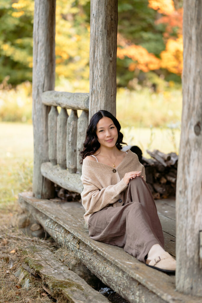 fall senior photos at a rustic cabin in minnesota